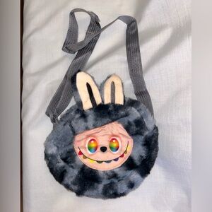 A Lafufu Monster Style Crossbody Bag. Gray w/Multi colored eyes, zipper closure